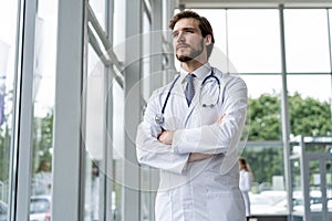 Happy male medical doctor portrait in hospital.