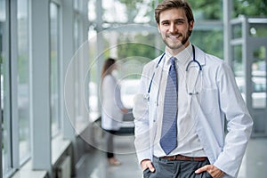 Happy male medical doctor portrait in hospital.