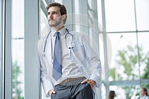 Happy male medical doctor portrait in hospital.