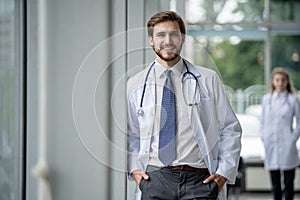 Happy male medical doctor portrait in hospital.