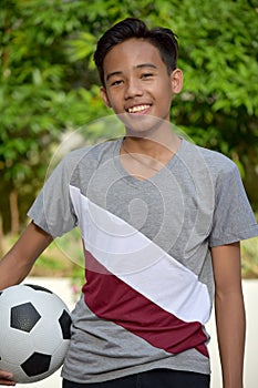 Happy Male Soccer Player With Soccer Ball