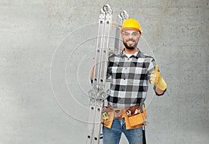 Happy male worker or builder in helmet with ladder