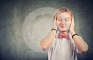 Happy man avoiding background noise and rumours