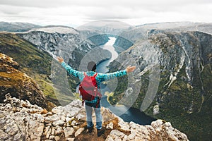 Happy Man backpacker on mountain summit traveling