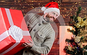 Happy man with beard santa hat. present for you. only my. advantageous offer of winter discounts. christmas shopping