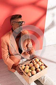 happy man in blazer and sunglasses