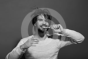 Happy man brush teeth with toothpaste, metrosexual