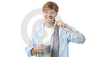 Happy man brushing teeth