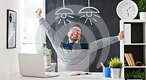 Happy man businessman, freelancer, student working at computer a