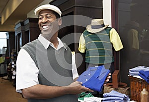 Happy Man Buying Shirt In Store