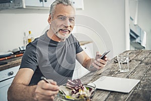 Happy man calling his business partner