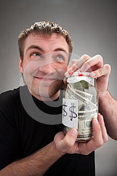 Happy man with canned money