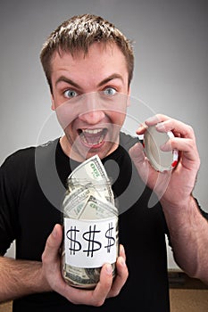 Happy man with canned money