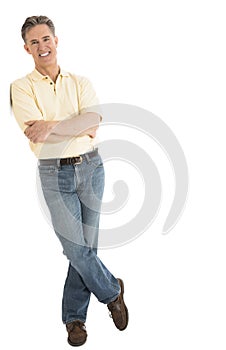 Happy Man In Casuals Standing Arms Crossed