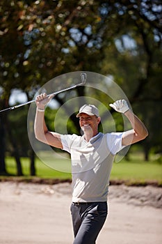 Happy man, celebration and golfer with fist pump for winning, victory or shot in sand pit. Excited male person or sports