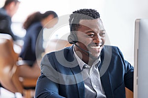 Happy man, computer and headphones in call center for customer service, consulting and operator. Male person, smile and