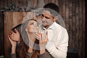 Happy Man covering woman`s eyes with his hands. Surprised girl i