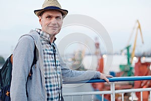 Happy man on the deck of cruise ship