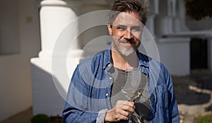 Happy man drinking wine outdoor