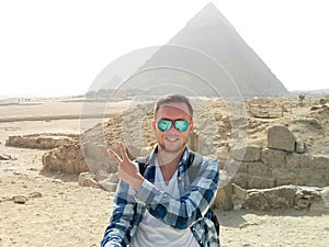 Happy man with the Egypt pyramids view