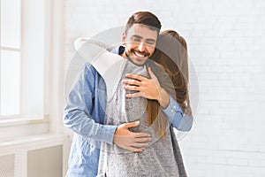 Happy Man Embracing Therapy Group Member After Treating Social Anxiety Disorder