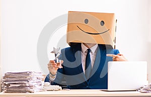 Happy man employee with box instead of his head