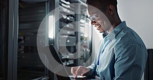 Happy man, engineer and laptop in server room for database update, cyber security or code. Computer, smile and African