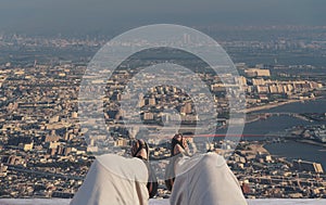 A happy man enjoying aerial city view in the morning. Travel lifestyle