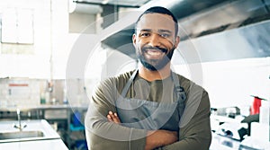 Happy man, face and small business owner in kitchen at restaurant for hospitality service, cooking or food. Portrait of