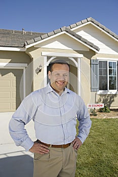 Happy Man In Front Of New House
