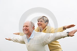 Happy man giving piggyback to woman