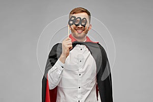 Happy man in halloween costume of vampire