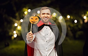 Happy man in halloween costume of vampire