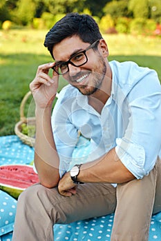 Happy Man. Handsome Smiling Young Male Outdoors In Park