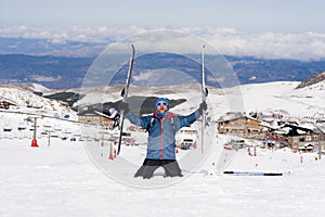 Happy man happy in snow mountains at Sierra Nevada ski resort in Spain