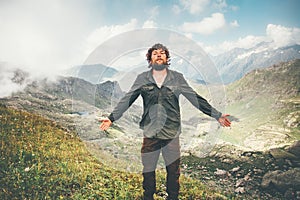 Happy Man hiking meditating in mountains