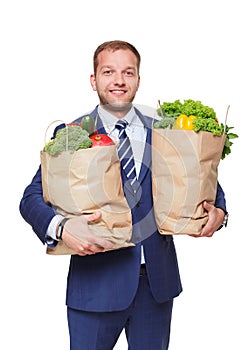 Happy man hold bag with healthy food, grocery buyer isolated