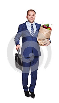 Happy man hold bag with healthy food, grocery buyer isolated
