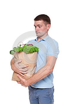 Happy man hold bags with healthy food, grocery buyer isolated