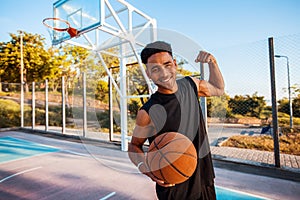 Happy Man holding basketball,street ball,man playing,sport competitions,outdoor portrait,sport games,handsome black man,pretty