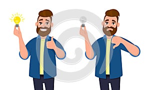 Happy man holding bright bulb and thumbs up gesture or sign. Unhappy man holding dull bulb and thumbs down gesture or sign. photo