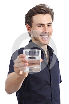 Happy man holding a glass with fresh water photo