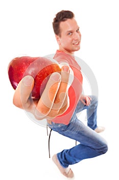 Happy man in holding offering apple. Diet health care healthy nutrition.