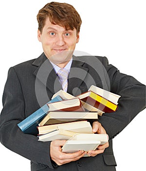 Happy man holding pile of books