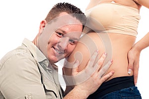 Happy man holding pregnant belly