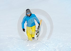 Happy man holding snowboard