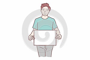 Happy man holding white blank banner and pointing at a copy space