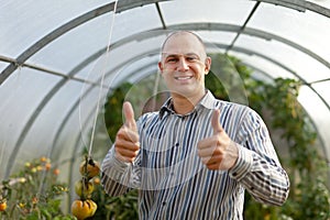 Happy man in the hothouse