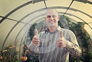 Happy man in the hothouse