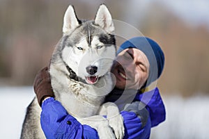 Happy man with a husky